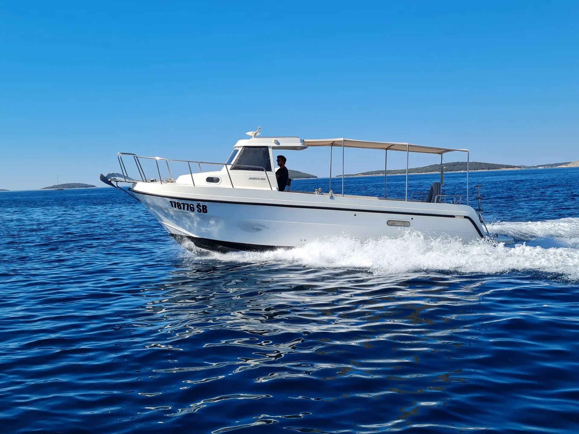 An Ardura boat on the water off Šibenik